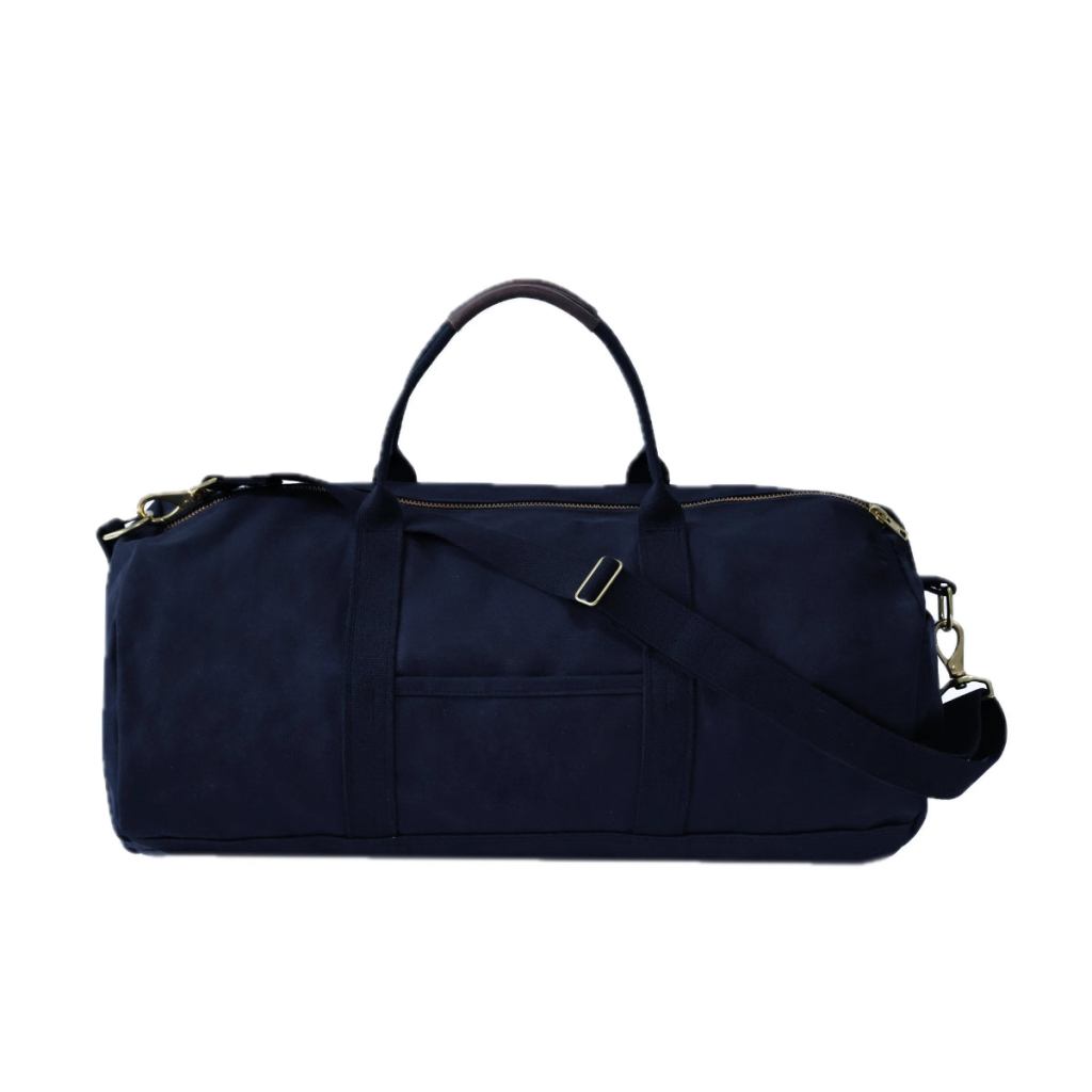 Rear view of a midnight-navy Steele Canvas duffle bag with handles, shoulder strap, and brass hardware.