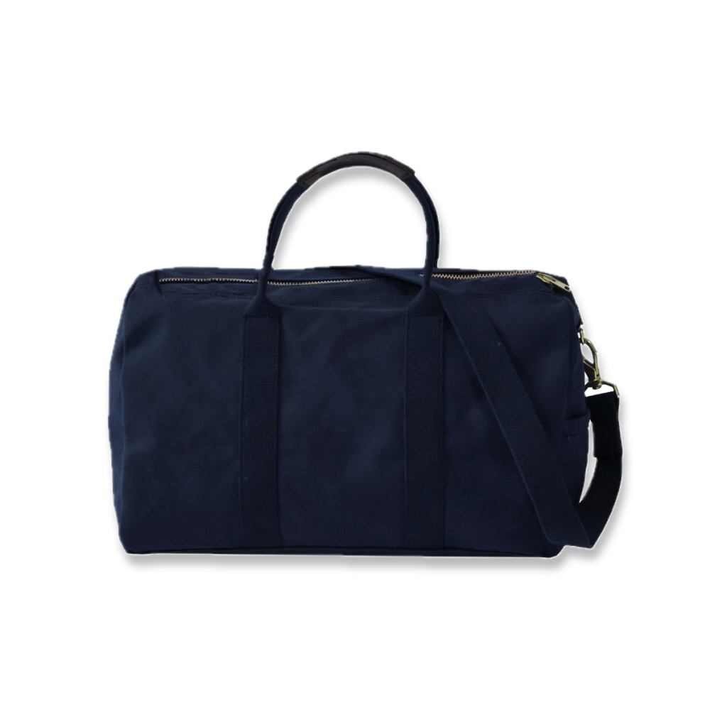 Rear view of a midnight-navy Steele Canvas travel bag with handles and shoulder strap.