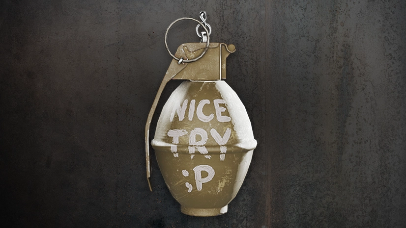 Nice Try grenade-shaped charm with handwritten lettering.